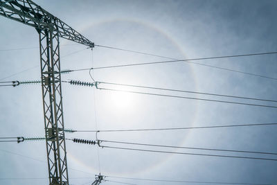 Low angle view of cables against clear sky