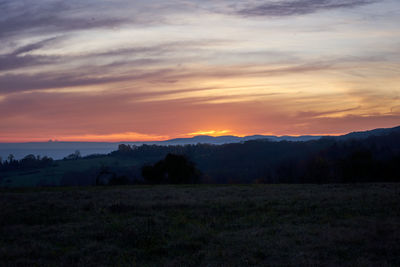 Scenic view of silhouette landscape against sky during sunset