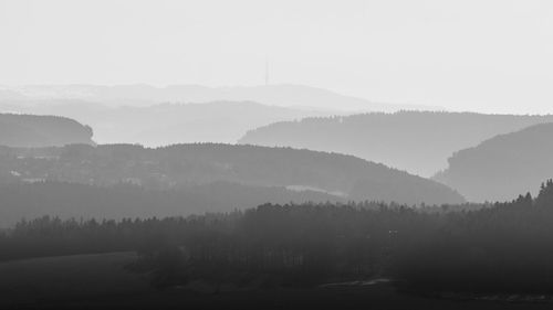 Scenic view of mountains against sky during foggy weather