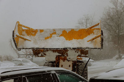 Close-up of damaged car on snow