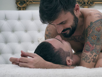 Young couple lying on floor