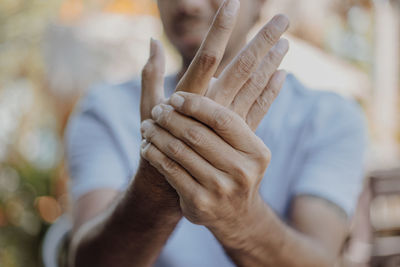 Close-up of human hand against blurred background