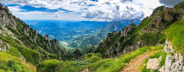 Panoramic view of landscape against cloudy sky