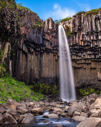 View looking up from base of svartifoss waterfall during an icelandic summer