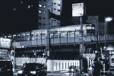 People on city street at night