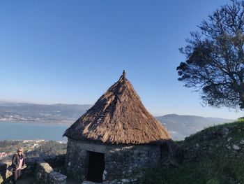 Panoramic view of built structure against clear blue sky