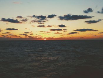 Scenic view of sea against sky at sunset