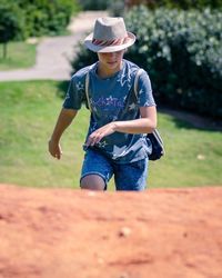 Boy walking at park