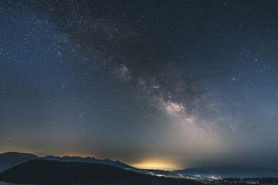 Scenic view of star field against sky at night