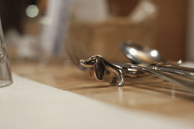 Close-up of cutlery rest on table