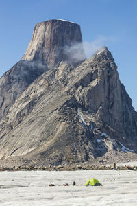 Tent set up on glacier below mount asgard, baffin island.