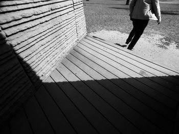 Low section of woman standing on tiled floor