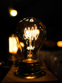 Close-up of illuminated light bulb