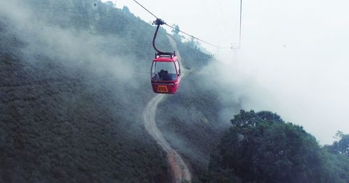 Cable car amongst fog in mountains