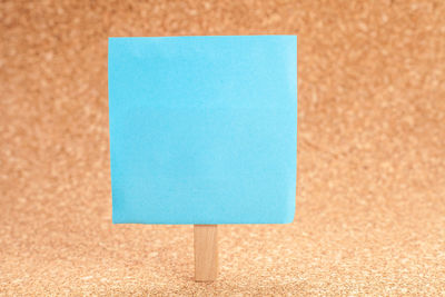 Close-up of blue adhesive note