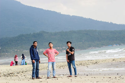 Young couple standing on beach