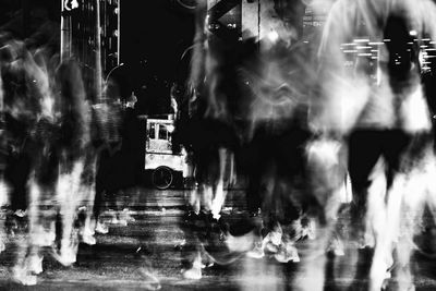 Blurred motion of woman at night