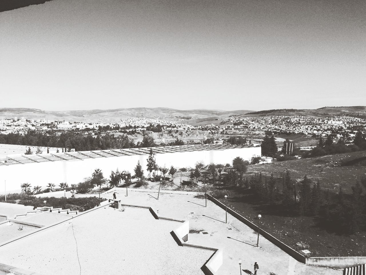 clear sky, snow, winter, built structure, copy space, architecture, building exterior, cold temperature, season, mountain, high angle view, day, outdoors, no people, landscape, nature, road, city, weather, covering