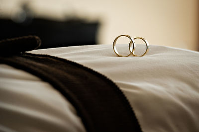 Close-up of wedding rings on metal