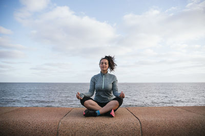 Girl meditating happy and peacefully