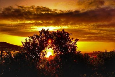 Scenic view of landscape against cloudy sky