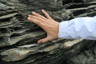 Close-up of hand on rock