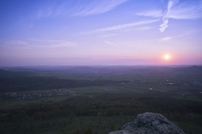 Scenic view of landscape against sky during sunset