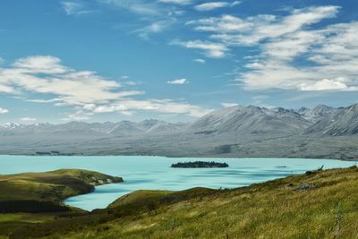 Scenic view of lake tekapo and mountains against sky