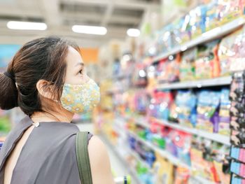 Side view of a woman in a store