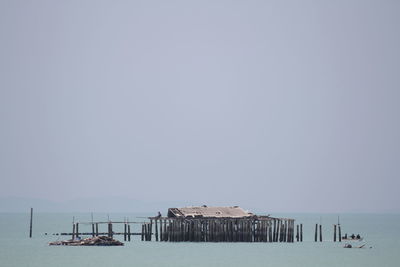 Lifeguard hut on beach against sky