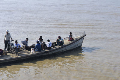 People on boat in sea