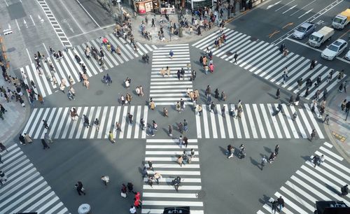 High angle view of people crossing road