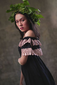 Portrait of beautiful young woman standing outdoors