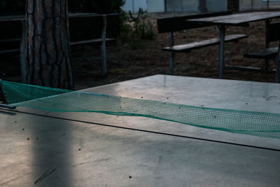 High angle view of chairs and table in swimming pool