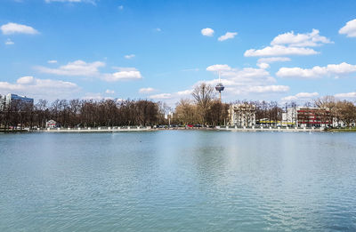 Scenic view of river against cloudy sky