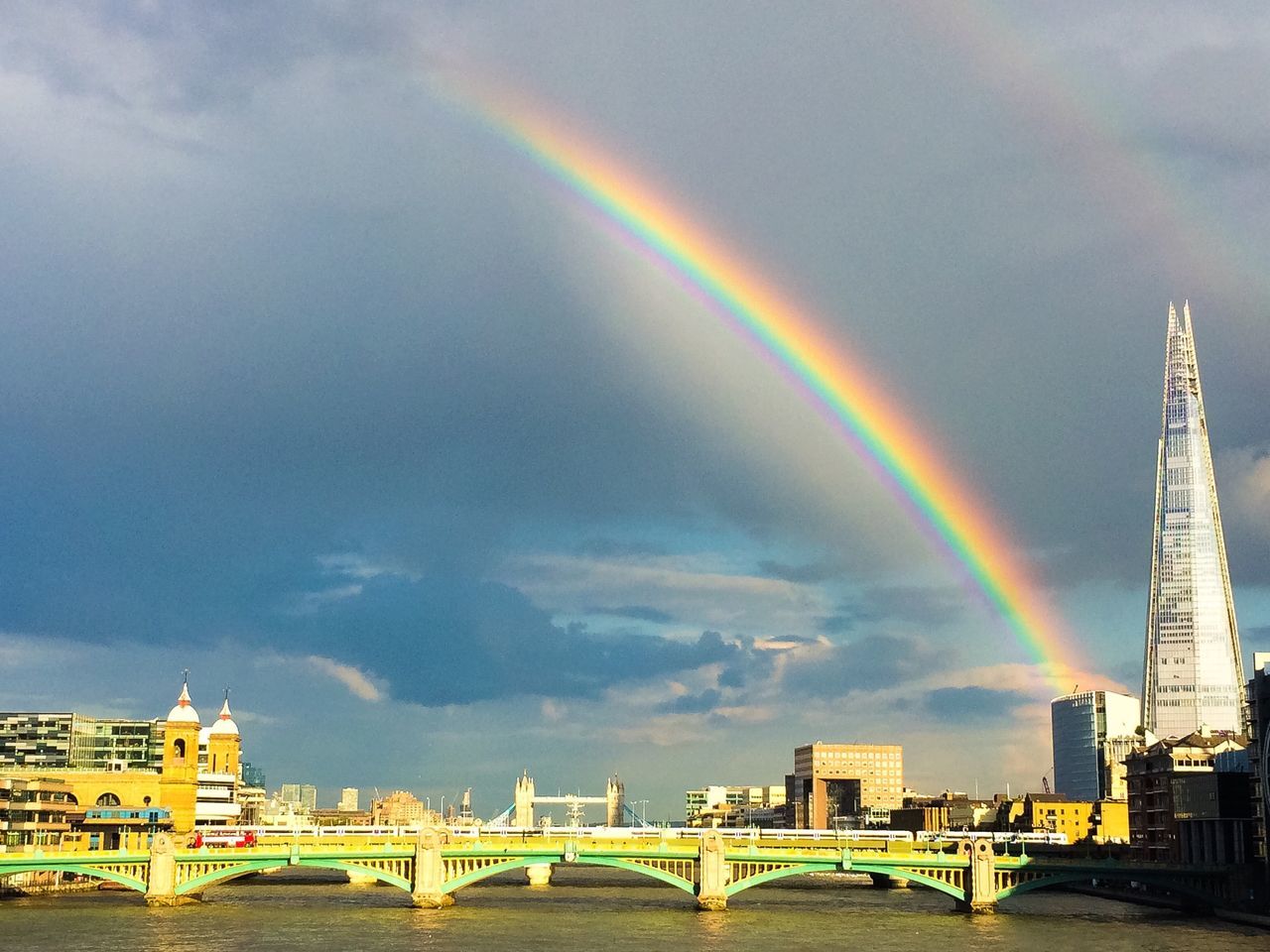 SCENIC VIEW OF RAINBOW OVER CITY