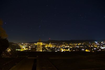 High angle view of illuminated buildings in city at night