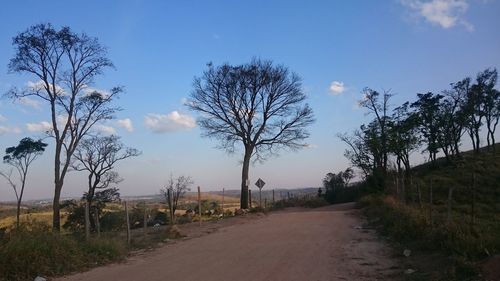 Empty road passing through landscape