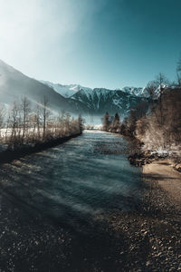 Scenic view of snowcapped mountains against sky