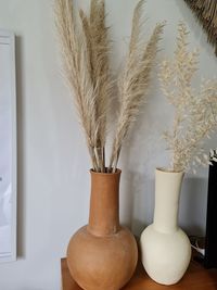 Close-up of white flowers in vase on table at home