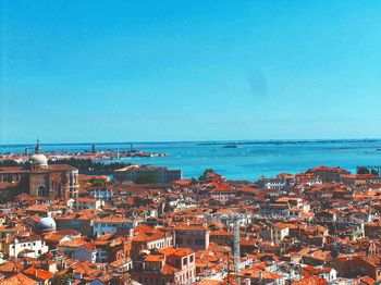 View of cityscape against blue sky