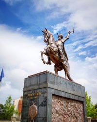 Low angle view of statue against sky