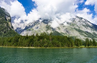 Scenic view of lake and mountains against sky