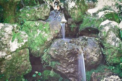 Woman looking at waterfall