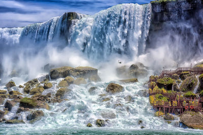 View of waterfall in sea