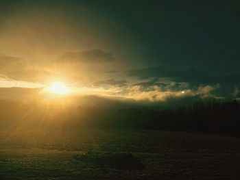 Scenic view of landscape against sky during sunset