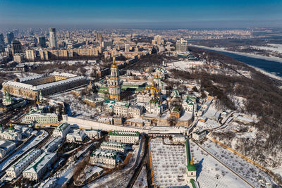 Beautiful winter top view of the kiev-pechersk lavra. many churches in the snow.