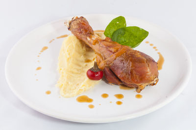 Duck meat in plate on table