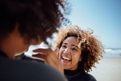 Woman applying sunscreen on the beach