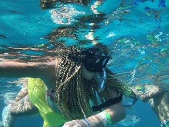 Teenage girl scuba diving underwater